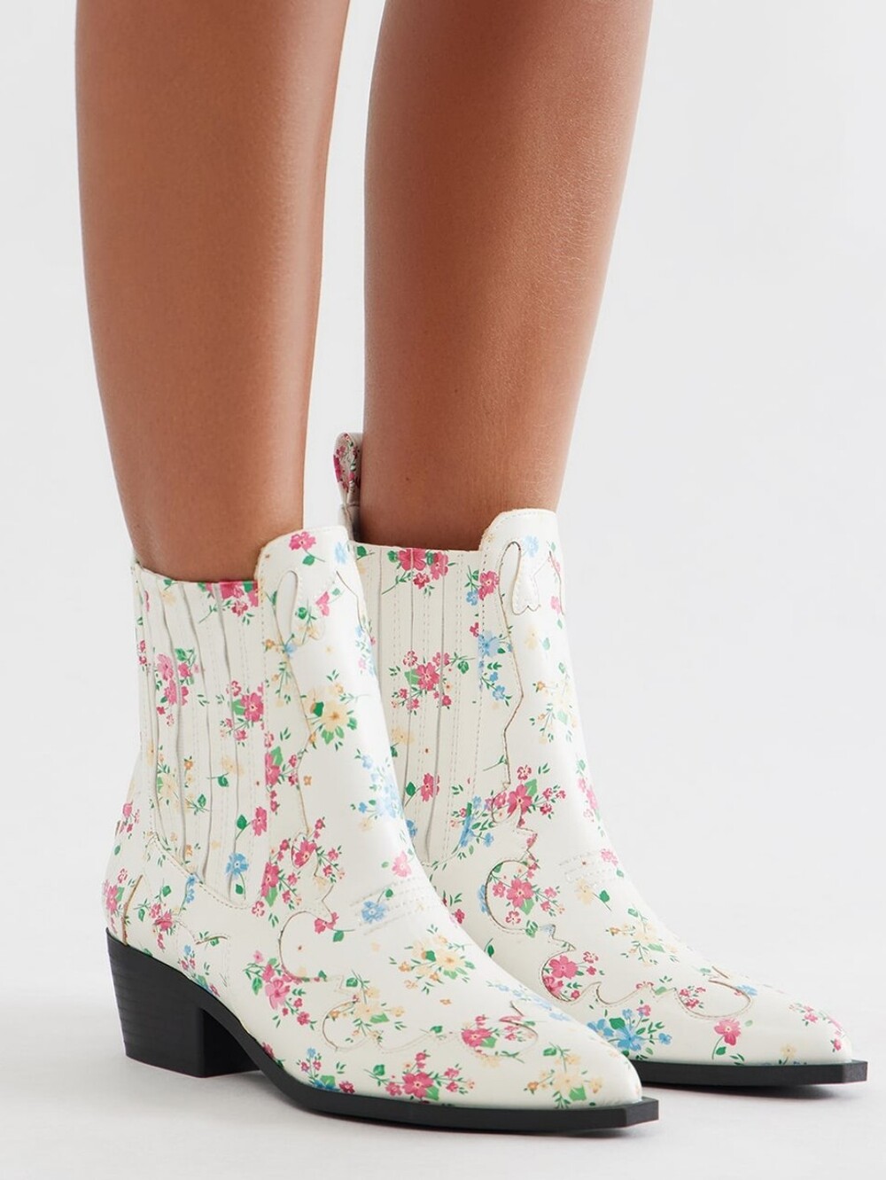 Women's demi-season cowboy-style ankle boots are a bright accent for your